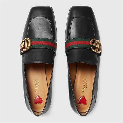 black loafers with red stripe.